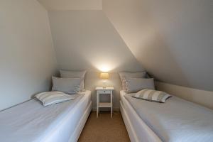 Кровать или кровати в номере Haus Wattblick OG +27 фотографий