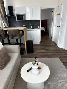 a living room with a couch and a coffee table at Lovely 1BR & 1LR Apartment, Only 15 Min Walk to City Center in Ghent