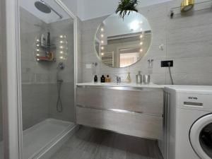 a bathroom with a sink and a shower and a mirror at A casa di Alida in Cotulo +31 photos