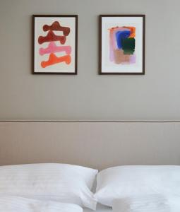 Postel nebo postele na pokoji v ubytování HeyMi Apartments Brick Lane Vienna + 53 fotografií