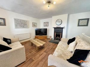 Posezení v ubytování Hundy Cottage