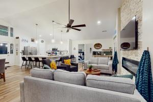 a living room with a couch and a table at Hawk’s Landing at Innsbruck in Helen