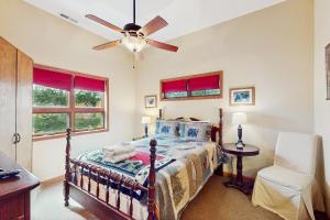 a bedroom with a bed and a ceiling fan at Eagle Rock in Beech Mountain