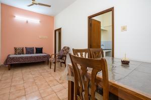 a dining room with a table and chairs at zest homes in Chennai