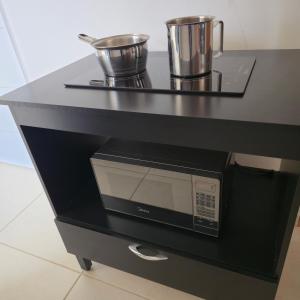 Kuchyň nebo kuchyňský kout v ubytování Ap Lagoa da Prata com Ar condicionado