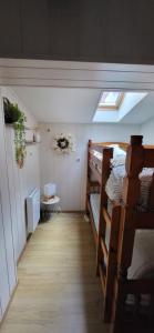 a attic room with two bunk beds and a skylight at La Bergerie d'Espiaube in Saint-Lary-Soulan