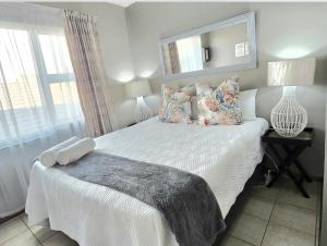 Postel nebo postele na pokoji v ubytování Zhantique Guest House 2- Unit 12 + 23 fotografií