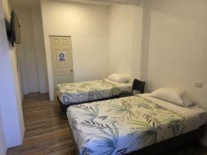 Postel nebo postele na pokoji v ubytování Hostal nancy