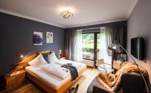 Postel nebo postele na pokoji v ubytování Hotel LÄRCHENHOF