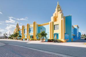 a street with a building on the side of a road at Tropical Beach Studio Getaway B in Cocoa Beach
