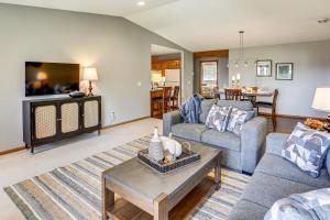 a living room with a couch and a table at Across from Tetonka Lake 4-Season Getaway! in Waterville