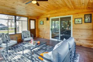 a living room with a couch and a table at Across from Tetonka Lake 4-Season Getaway! in Waterville
