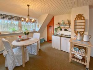a kitchen with a table and a sink and a counter at Landhaus Bez III in Schleyreuth