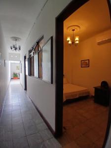 a hallway with a room with a bed in it at Apartamento Amplio y Cómodo en el centro de Palmira in Palmira