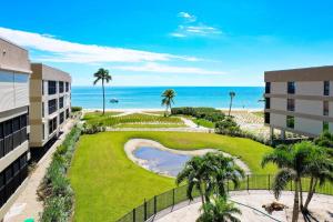 a view of the beach from the balcony of a resort at Kings Crown 309 in Sanibel