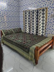 Postel nebo postele na pokoji v ubytování FullMoon Guesthouse