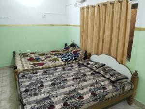 Postel nebo postele na pokoji v ubytování FullMoon Guesthouse