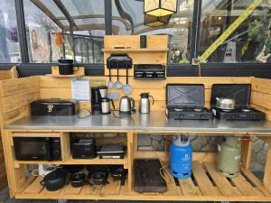 a table with appliances on top of it at ArdennenHut on Wheels in Durbuy
