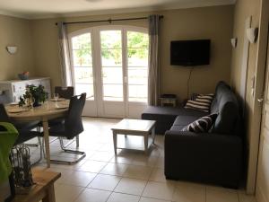 Posezení v ubytování Appartement dans Residence – Le Domaine de Camiole