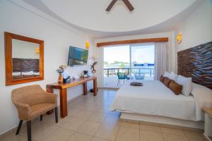TV a/nebo společenská místnost v ubytování Quinta Bella Huatulco
