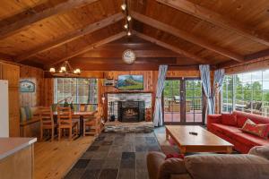 a living room with a couch and a fireplace at Emerald Arrowhead Haus - For 6 in Lake Arrowhead