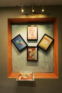 a group of pictures in a frame on a wall at Soul History Hotel Phu Quoc in Phu Quoc
