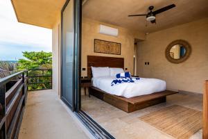 Ένα ή περισσότερα κρεβάτια σε δωμάτιο στο Selva Spirit at Torre Jungla +25 φωτογραφίες