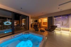 a jacuzzi tub in the middle of a living room at Suite romantique Zen Energie in Volx +14 photos