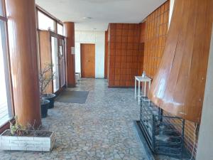 a hallway of a building with wooden walls at Playa Bristol, frente al MAR y vista a las mejores PLAYAS de Mar del Plata, a pasos del TORREÓN y del CASINO in Mar del Plata