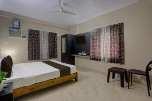 Ένα ή περισσότερα κρεβάτια σε δωμάτιο στο Hotel O New Marine Drive Puri Formerly Padmahar +22 φωτογραφίες