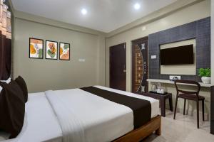 Ένα ή περισσότερα κρεβάτια σε δωμάτιο στο Hotel O New Marine Drive Puri Formerly Padmahar