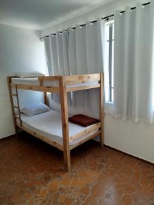 Ένα ή περισσότερα κρεβάτια σε δωμάτιο στο Hostel União bh