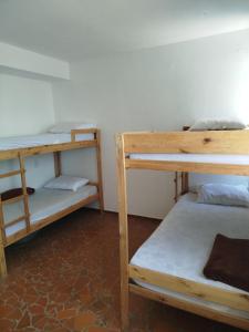 Ένα ή περισσότερα κρεβάτια σε δωμάτιο στο Hostel União bh