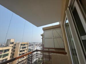 a balcony with a view of a city at MG Luxury Stays - Entire 4 BHK in Panchkula