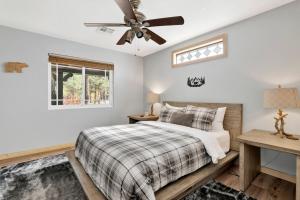 a bedroom with a bed and a ceiling fan at Sugarloafing #701 in Sugarloaf