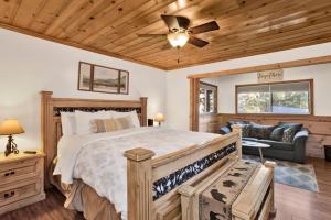 a bedroom with a bed and a ceiling fan at Entertainment Cabin #610 in Sugarloaf