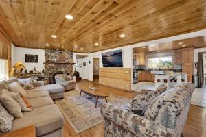 a living room with a couch and a table at Entertainment Cabin #610 in Sugarloaf