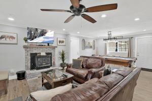 a living room with a couch and a pool table at Brewer Escape #609 in Sugarloaf