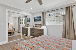 a bedroom with a bed and a large mirror at Brewer Escape #609 in Sugarloaf