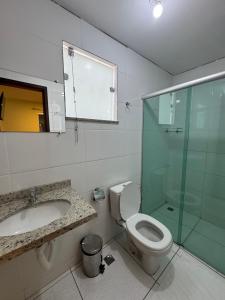 a bathroom with a toilet and a sink and a shower at Domus Hotel Rio Verde - Parauapebas in Parauapebas +27 photos