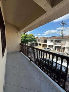 a balcony of a building with a view of a street at Neoma Houses in Cali