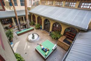 an overhead view of a person on a pool in front of a building at HI Los Angeles - Santa Monica Hostel in Los Angeles