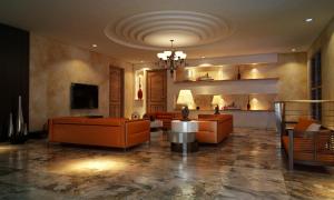 Elle comprend un salon doté d'un mobilier orange et d'un plafond. dans l'établissement Yasuragi Boutique Resort, à Shencottah