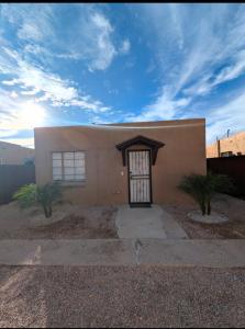 a small house with a door in front of it at Rancho Las Casitas in Tucson