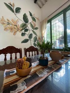 a room with a table with bowls of corn on it at Madreselva Hostel in Yala