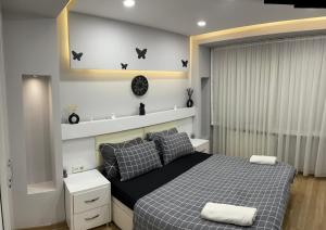 a bedroom with a bed with pillows and bats on the wall at Yakut suites Sultanahmet in Istanbul +19 photos