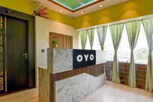 Postel nebo postele na pokoji v ubytování Hotel O PALLAVI INN