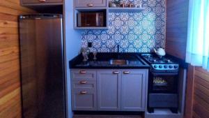 a small kitchen with a sink and a stove at Romantic Getaway with Jacuzzi and Breakfast in Rancho Queimado in Rancho Queimado +9 photos