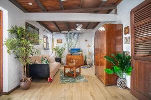 a living room with a couch and a table at Appartement Alizé Vue Imprenable Sur La mer in Sainte-Luce