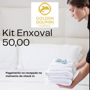 a woman standing next to a pile of towels at Golden Dolphin Express in Caldas Novas +29 photos